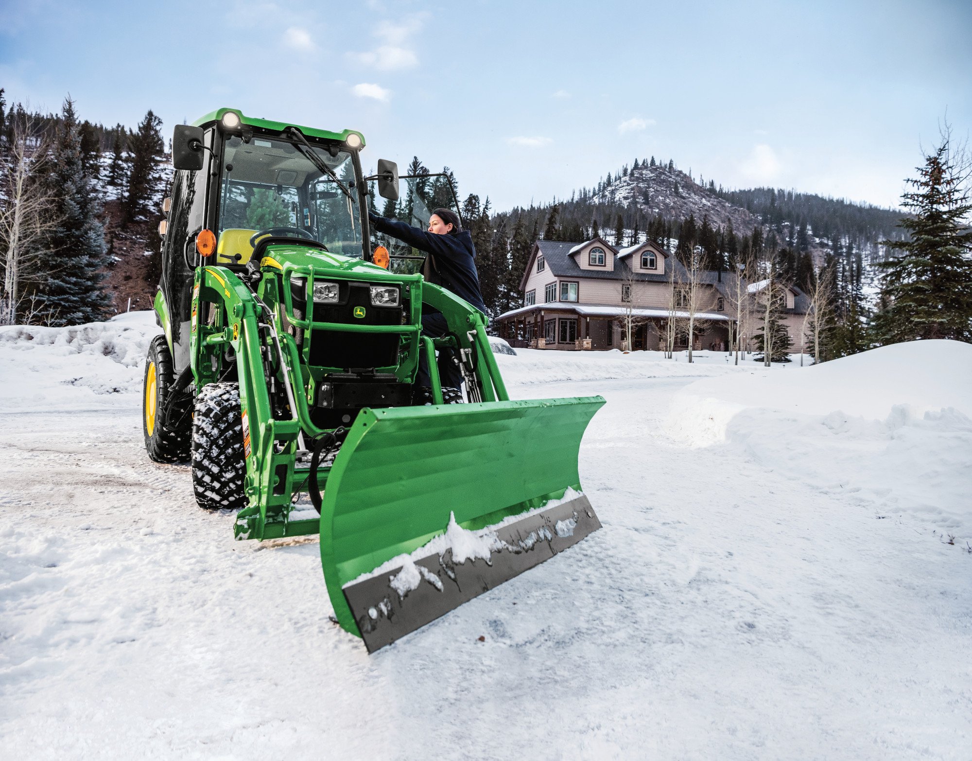 John Deere 1025R with cab and Frontier front blade