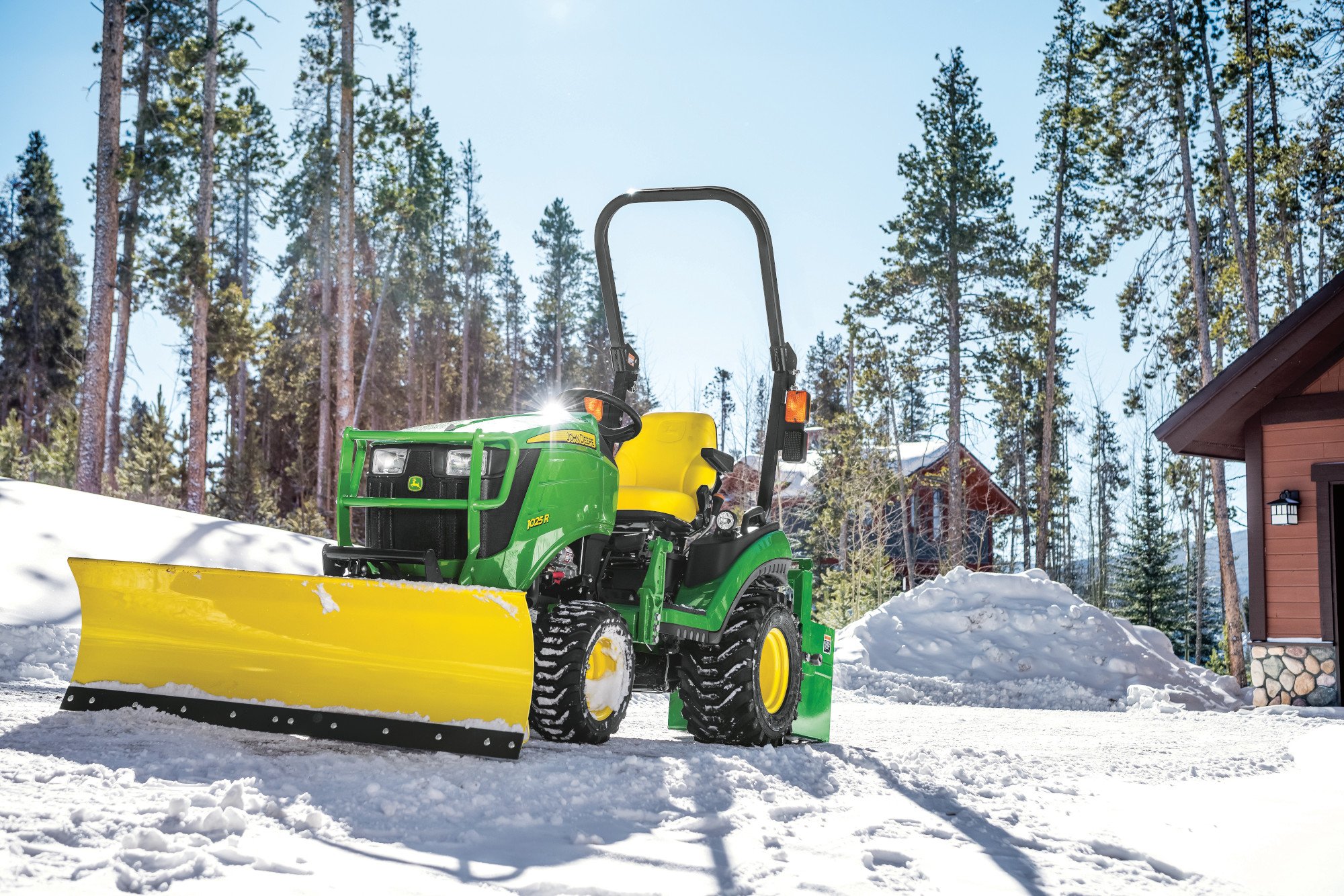 John Deere 1025R with quick hitch front blade